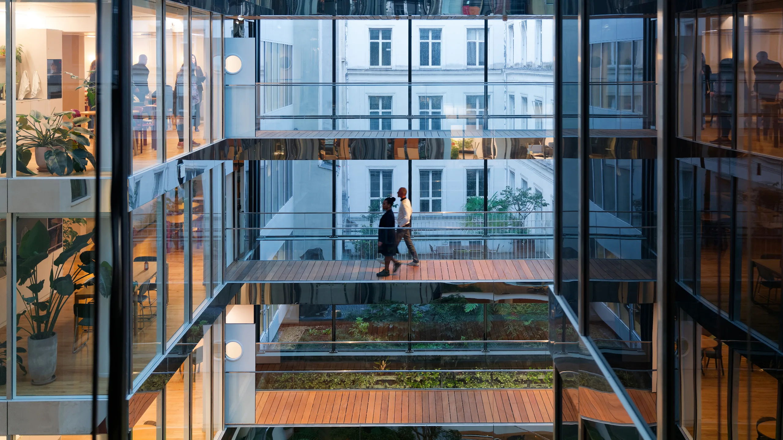 multi-racial group of businesswomen viewing new office space with an estate agent